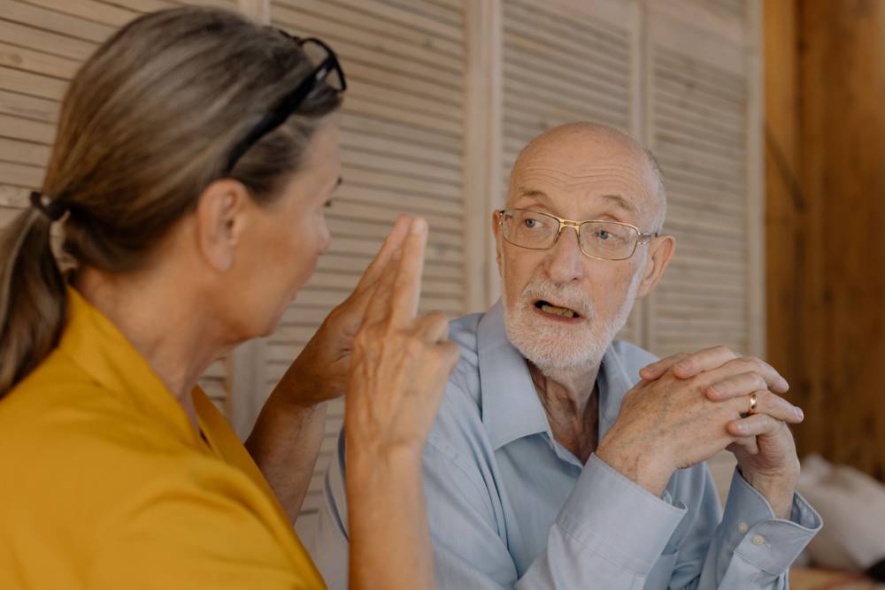 Two older people deep in conversation